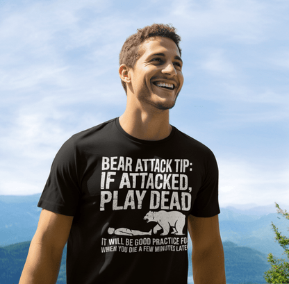 Man smiling outdoors wearing the Bear Attack Tip T-Shirt, showcasing its classic design and comfort, ideal for outdoor enthusiasts.