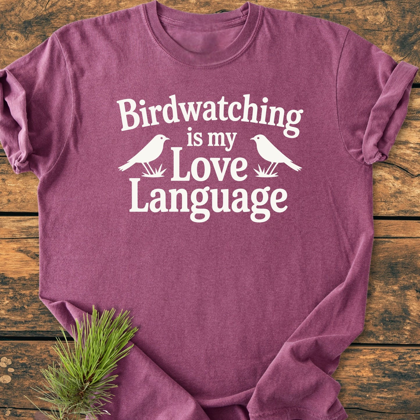 Heather-purple T-shirt labeled 1428 Birdwatching Love Language, features bold white text and bird silhouettes. Soft vintage wash fabric, relaxed unisex fit, ideal for everyday comfort and style.