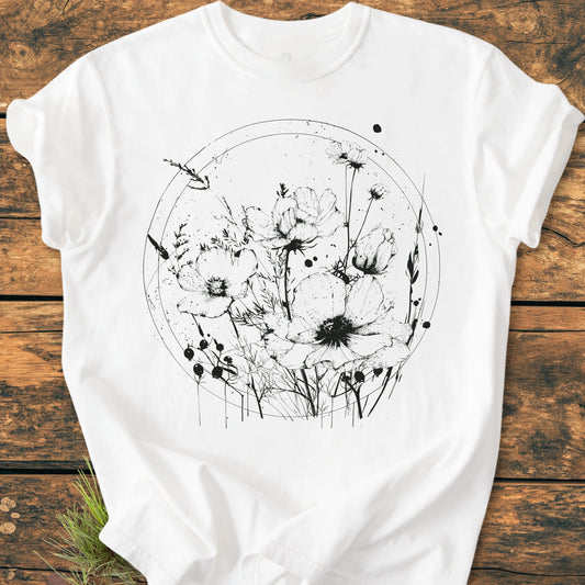 391 Wildflower Circle T-shirt features a black line-art illustration of poppies on a white crew-neck. Made from soft 100% ring-spun cotton, it's perfect for relaxed, daily wear.