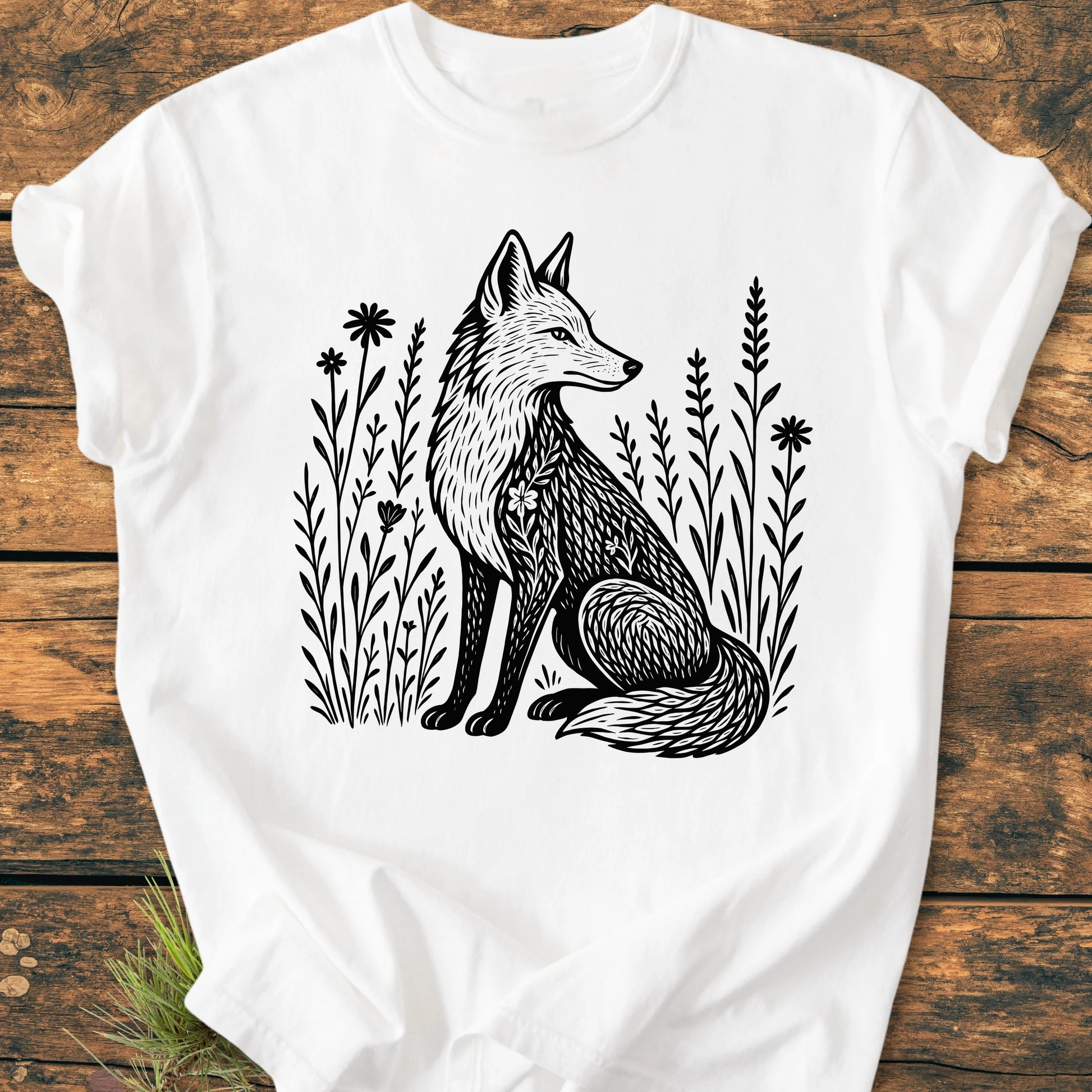 225 Wildflower Fox DARK T-shirt features a black-ink fox illustration with stylized patterns, surrounded by wildflowers, on a soft, garment-dyed 100% ring-spun cotton fabric, offering a relaxed and durable fit.