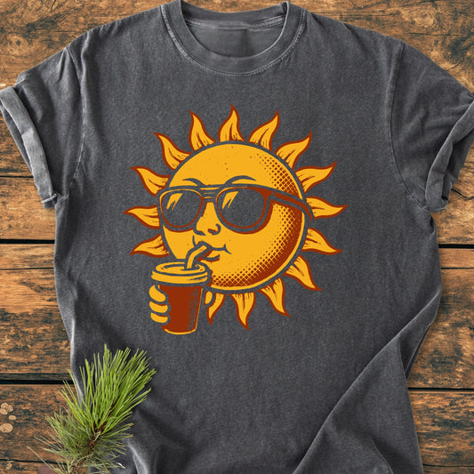 235 Sun With Coffee T-shirt features a stylized sun graphic sipping a drink, on a dark gray, soft-washed, garment-dyed cotton tee, offering a relaxed fit and durability.