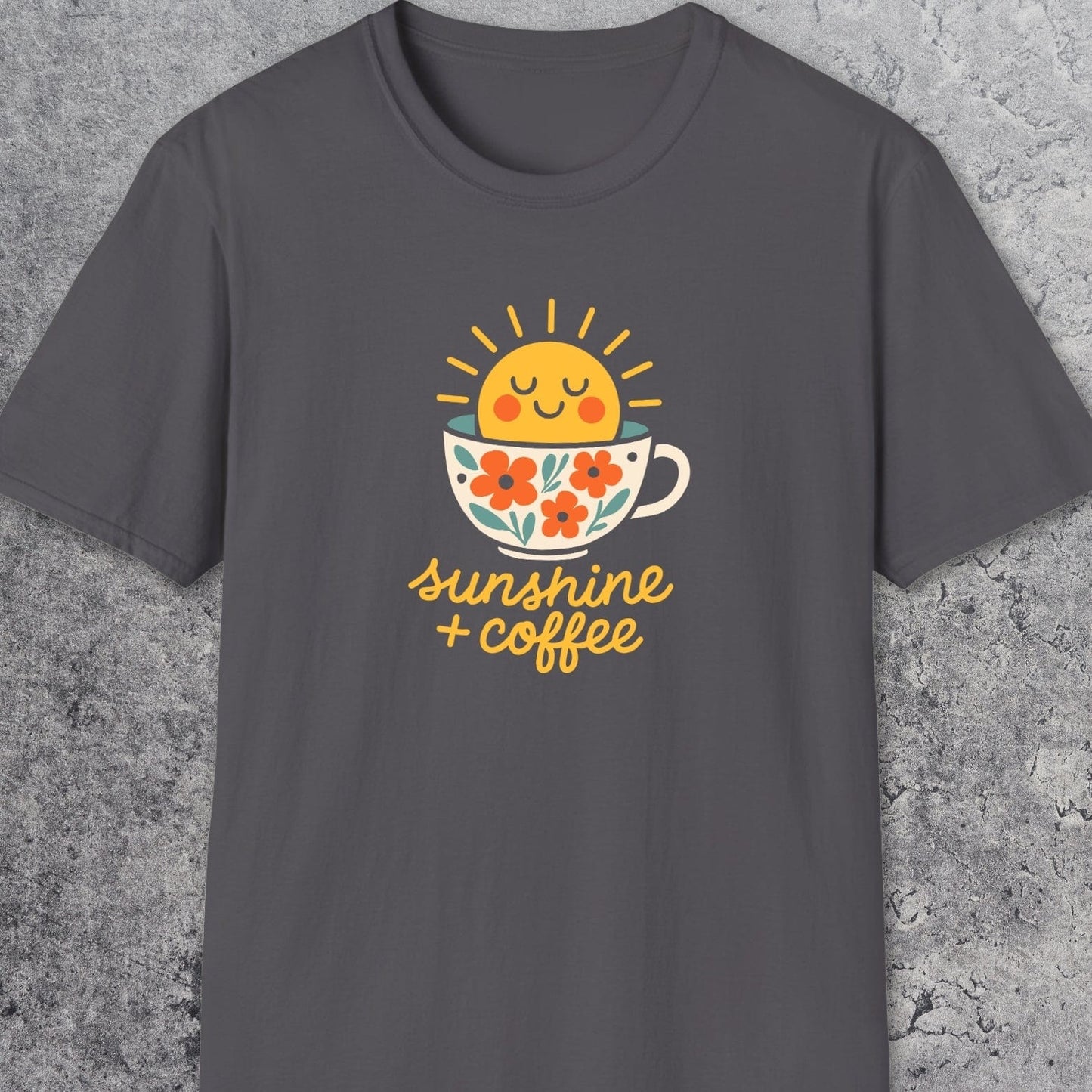Sunshine And Coffee T-Shirt featuring a cheerful sun rising from a flower-patterned cup, with sunshine + coffee text; soft cotton, unisex, ideal for adventures.