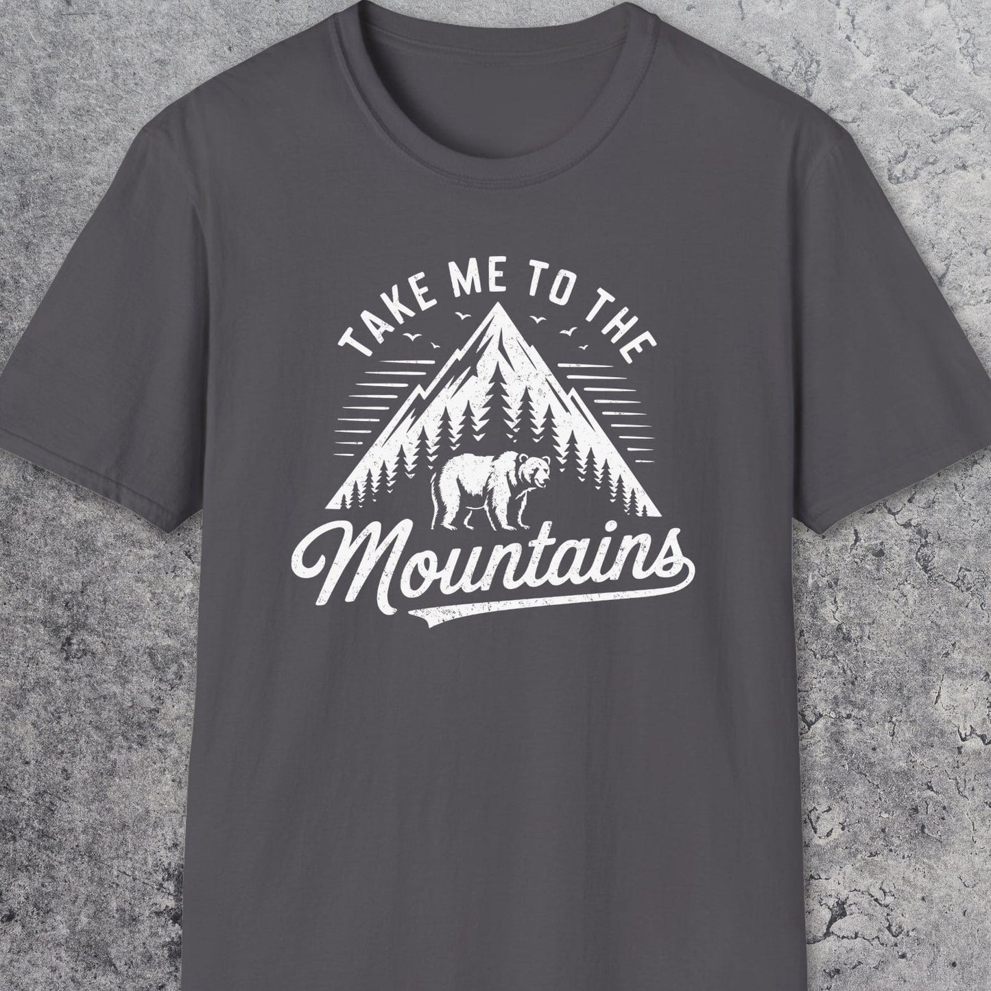 Take Me To The Mountains T-Shirt with a mountain, trees, bear graphic. Soft cotton, unisex fit, ideal for outdoor adventures and casual wear.