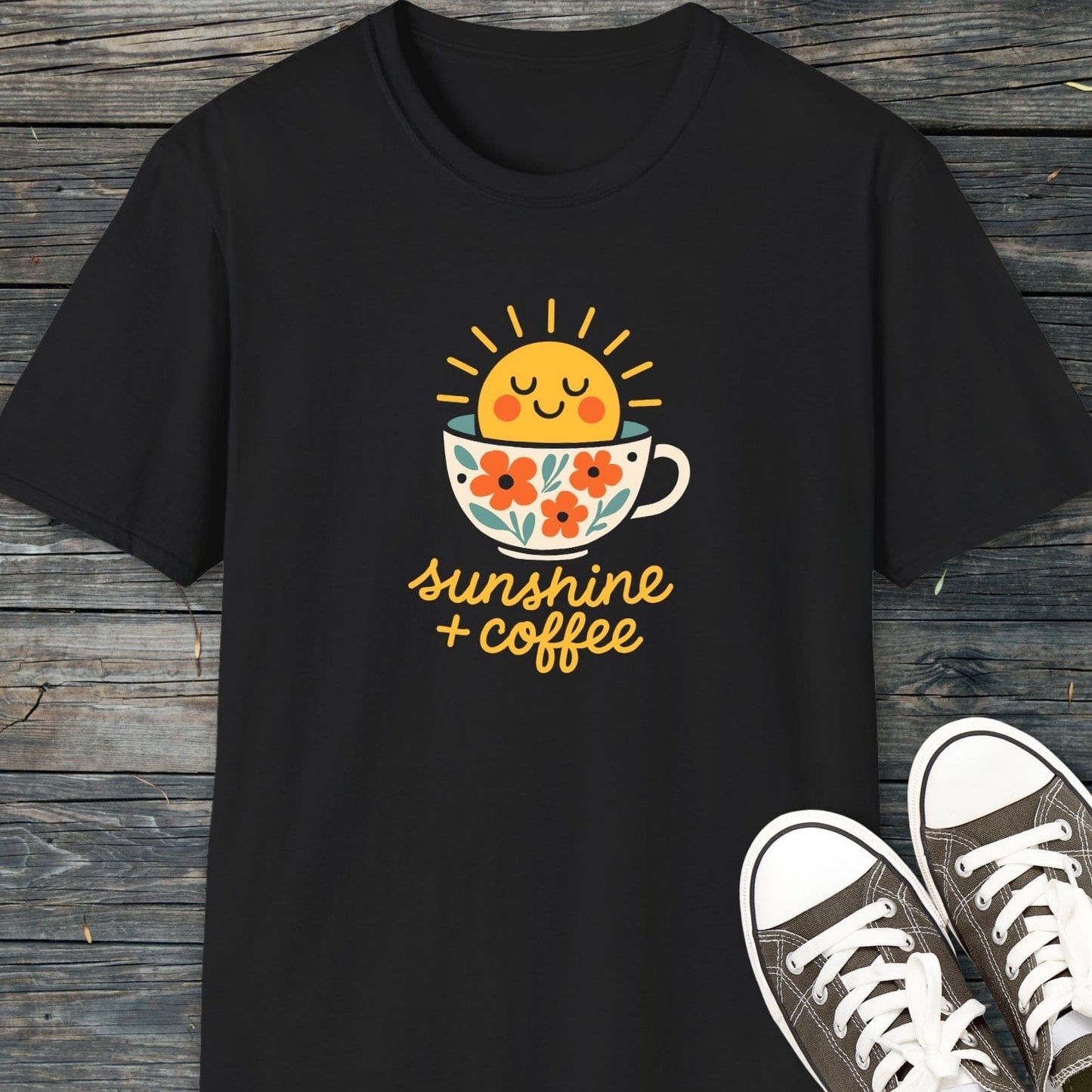 Sunshine And Coffee T-Shirt featuring a sun in a coffee cup graphic. Made of soft, lightweight cotton, ideal for various activities. Paired with canvas sneakers.