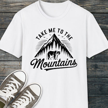 Take Me To The Mountains T-Shirt with a graphic of a mountain and bear, designed for comfort and adventure, paired with casual canvas sneakers.