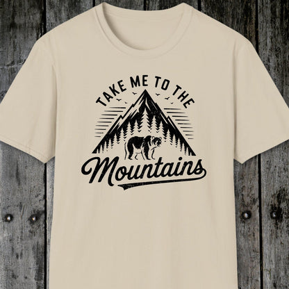 Take Me To The Mountains T-Shirt featuring a vintage-style mountain graphic with a bear, birds, and sun-ray lines. Soft, lightweight cotton ideal for adventures.