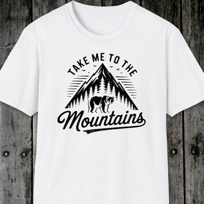 Take Me To The Mountains T-Shirt with a mountain and bear graphic, designed for comfort and adventure, featuring durable prints and a unisex fit.