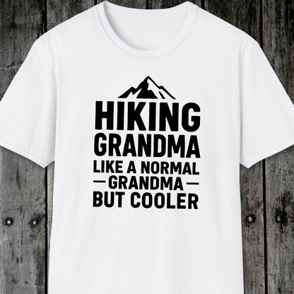 White T-shirt featuring a mountain graphic and Hiking Grandma text, crafted from soft cotton for comfort, designed for outdoor enthusiasts.