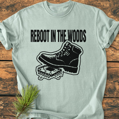 Reboot In The Woods - Vintage Wash Tee featuring a hiking boot on a CPU graphic, spruce branch accent, on rustic wood. Relaxed fit, durable stitching, soft-washed for comfort.