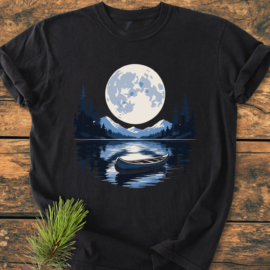Moonlit Canoe - Vintage Wash Tee features a stylized lake scene with a moonlit canoe, printed on a black T-shirt. Crafted from soft, garment-dyed cotton for comfort and durability.