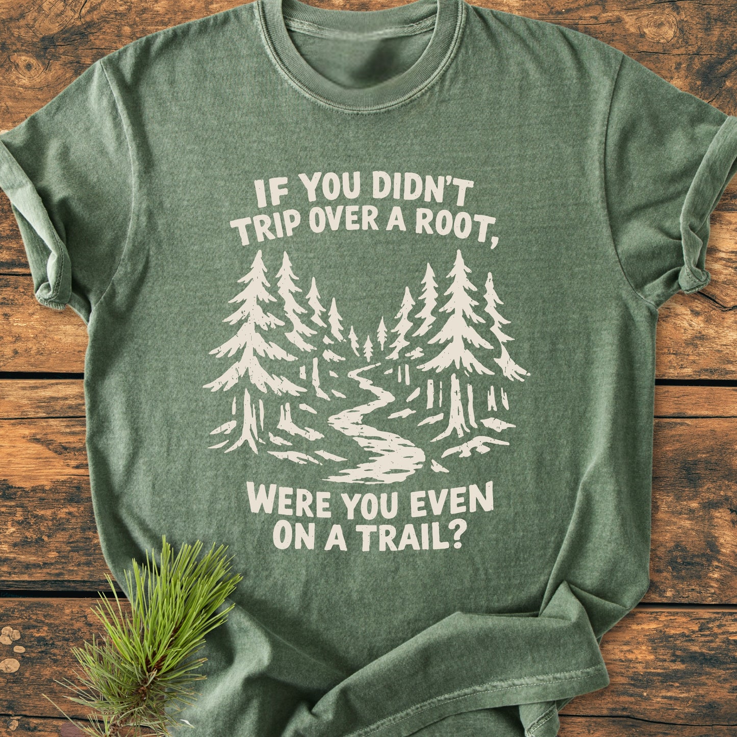 Were You Even On A Trail? - Vintage Wash Tee features a green-heathered design with an off-white forest scene and slogan, laid on wood. Crafted from soft-washed, garment-dyed 100% ring-spun cotton.