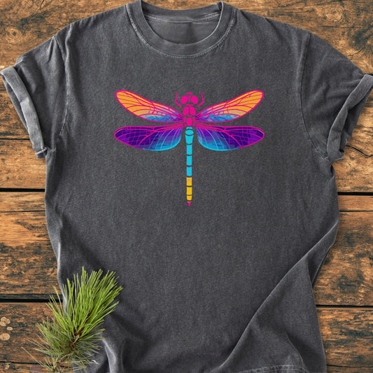 Psychedelic Dragonfly - Vintage Wash Tee: Charcoal-gray short-sleeve t-shirt with a vibrant dragonfly graphic, laid on rustic wood. Features soft, garment-dyed cotton and relaxed fit, showcasing durability and comfort.