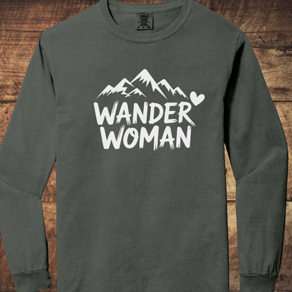 Wander Woman Comfort Colors Long-Sleeve Tee features a stylized mountain silhouette with “WANDER WOMAN” text and a heart icon, offering a relaxed fit and soft, garment-dyed 100% ring-spun cotton fabric.
