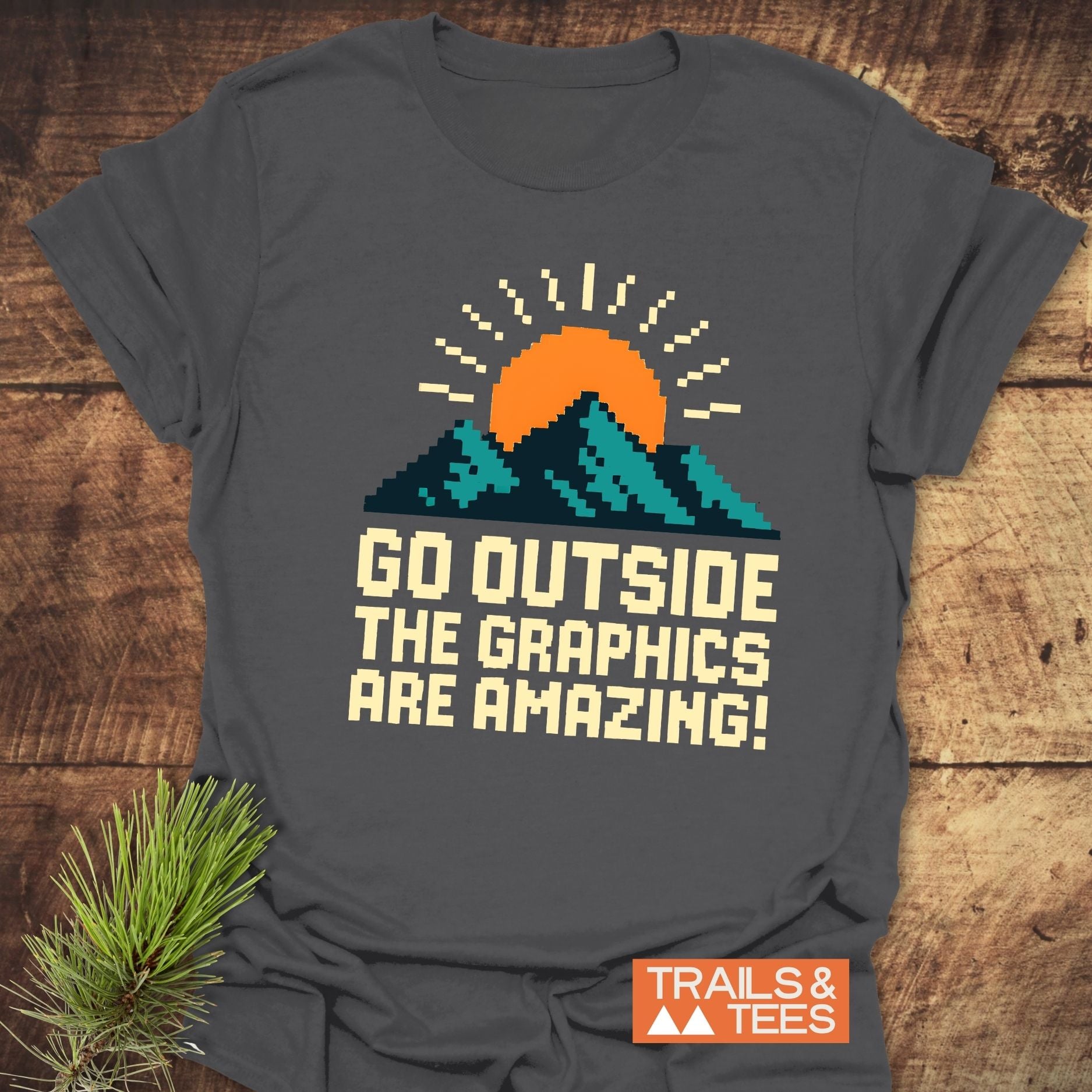 Go Outside Pixelart Mountain T-Shirt featuring a mountain and sun design on soft, lightweight cotton, ideal for outdoor enthusiasts seeking comfort and adventure.