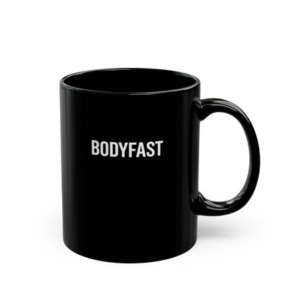Plain black BODYFAST Ceramic Mug with a simple handle, featuring BODYFAST in white all-caps on the front. Suitable for hot drinks, BPA and lead-free, microwave and dishwasher-safe.