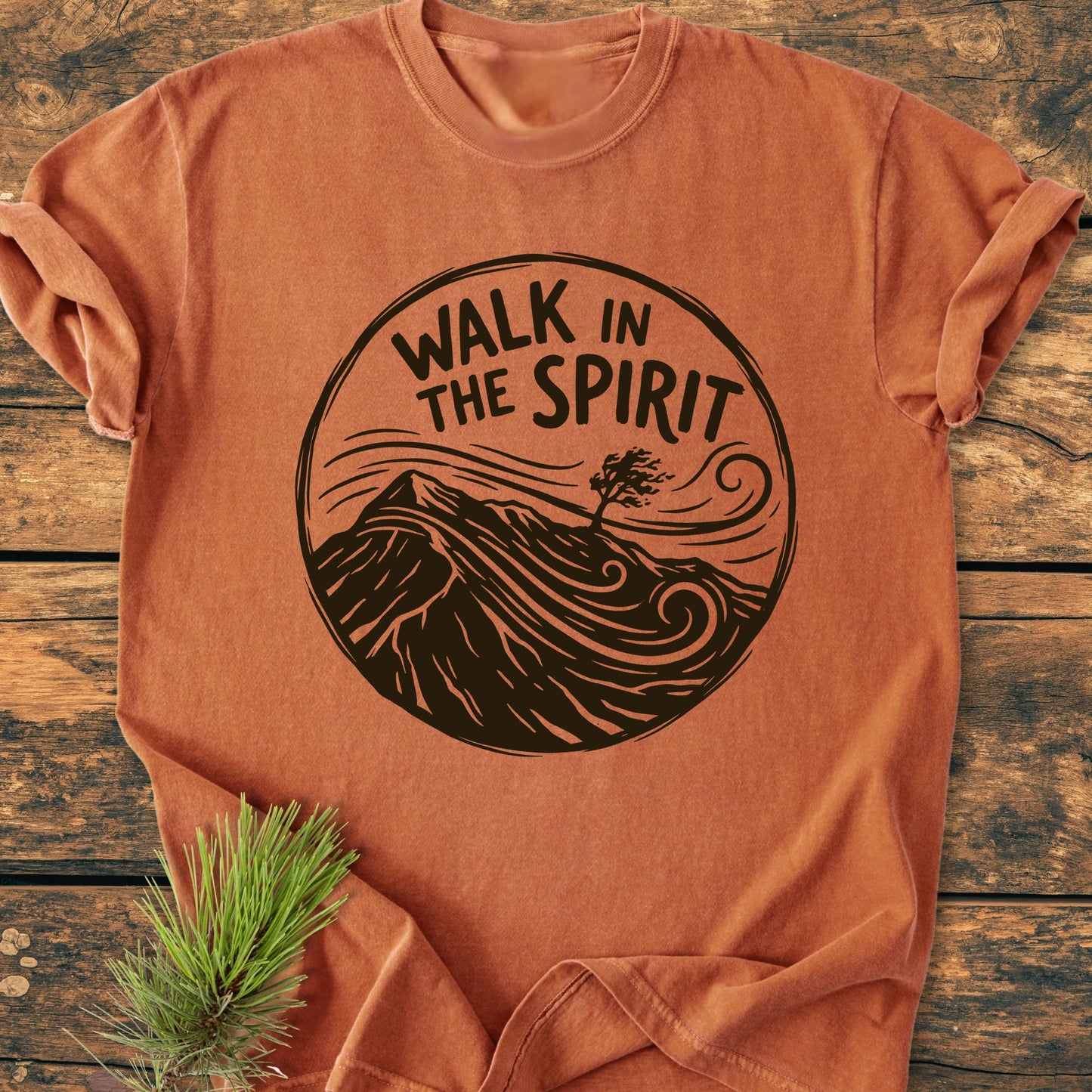 The 1410 Walk In The Spirit T-shirt features a windswept tree illustration with the phrase WALK IN THE SPIRIT, combining comfort and style in soft, garment-dyed, 100% ring-spun cotton.